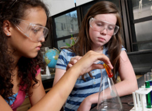 Photo of two students working on an experiment
